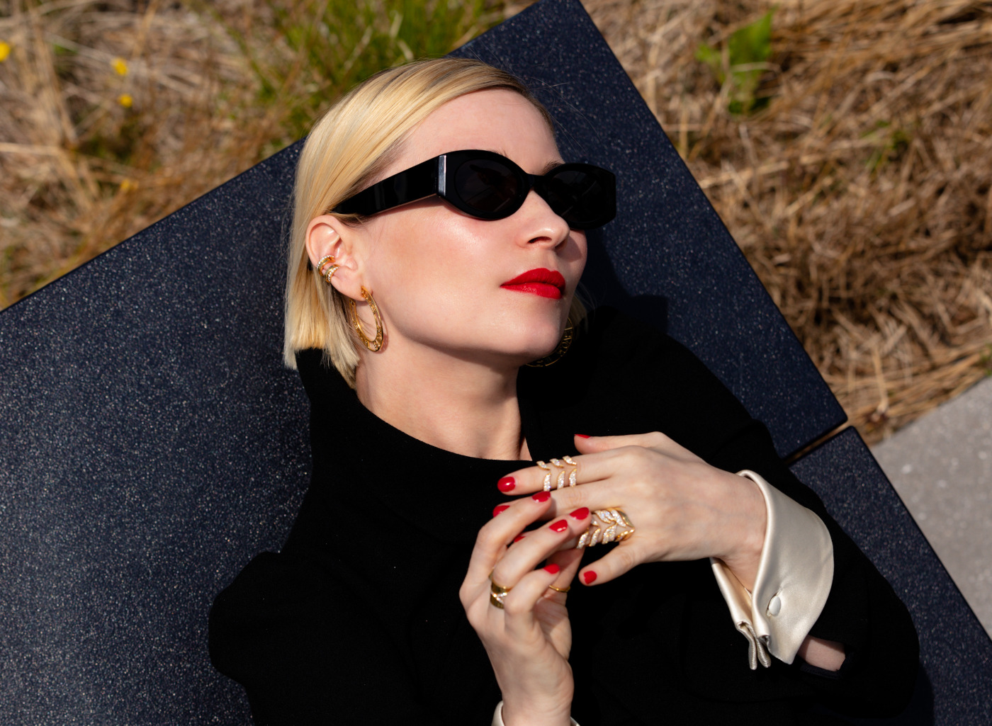 Natalia Zemliakova wearing Auvere gold jewelry and sunglasses